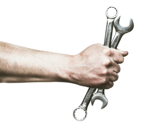 Mechanic holding wrenches